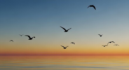 Obraz premium Graceful Birds Soaring Over Reflective Water at Vibrant Sunset, Evoking Freedom and Serenity