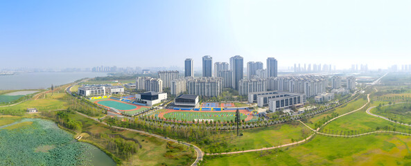 Modern City District Panoramic Aerial View with Sports Complex © LeVan