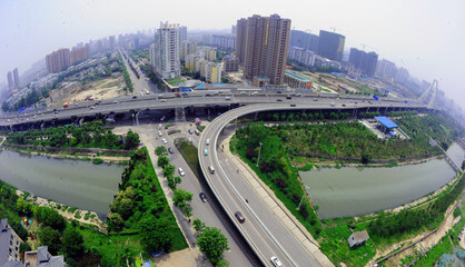 Wuhan Huangxiao Overpass Aerial Panoramic View with River and Urban Greenway © LeVan