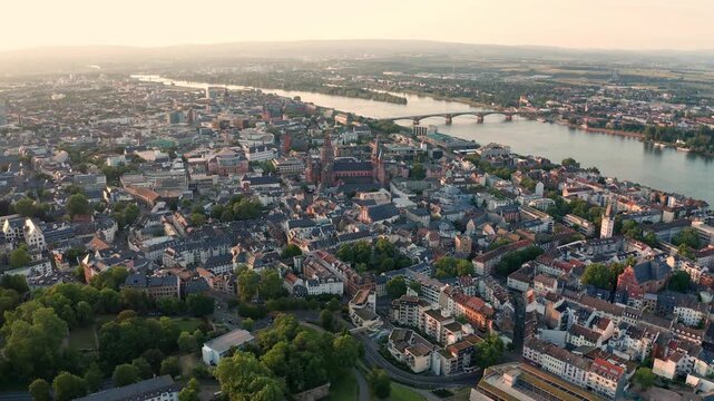 Aerial view of Mainz city center and Rhine river at sunset with cathedral and bridges in Germany