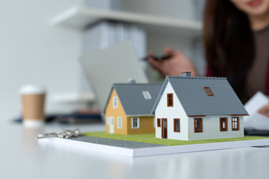 Close-up of Miniature House Models on Desk