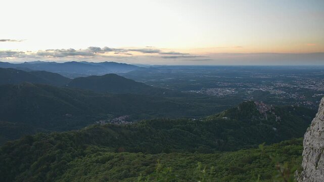 Sunrise over Sacro Monte di Varese, Santa Maria del Monte UNESCO site, panoramic view of Campo dei Fiori, Po Valley, and distant Apennines, Lombardy, Italy