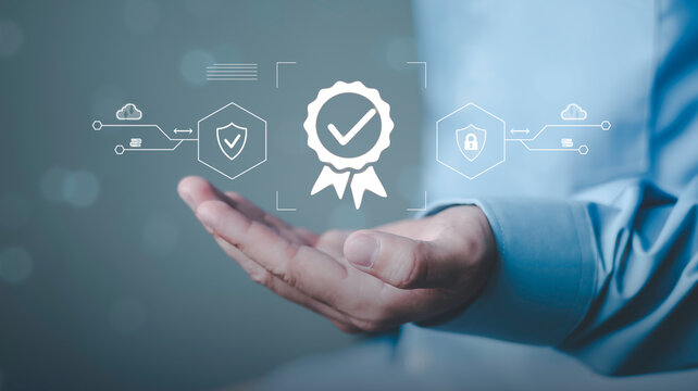 Cybersecurity compliance, trust verification, data protection, and enterprise digital safety. Businessman holding digital quality certification badge, security shield and cloud protection icons