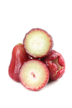 Fresh Red Wax Apples with Water Droplets Cut in Half Showing Interior