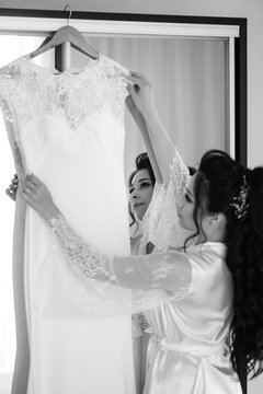 preparations for the bride with the dressing of the wedding dress