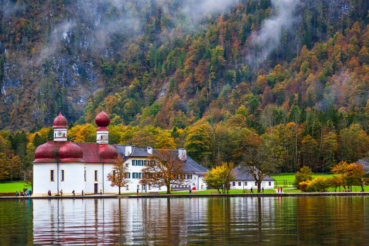 St. Bartholomew Church in Konigssee, Germany, with its beautiful lake and mountain scenery in autumn.