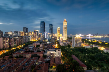 Wuhan Skyline at Dusk with Illuminated Skyscrapers and Yangtze River Bridge © DoThi