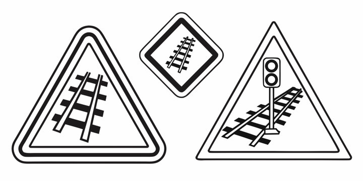 Road signs indicating railway crossing and a level crossing with a barrier