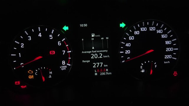 Car Dashboard Instrument Cluster Close-Up at Night, Illuminated Speedometer, Tachometer and Fuel Economy Display, Modern Vehicle Driving Interface, Automotive Technology 4K Footage