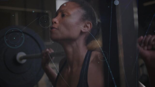 Lifter bracing and initiating back squat for strength with barbell spotter hand HUD crossing frame