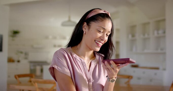 Woman reading alert on phone tapping, speaking, replying via voice msg for technology in kitchen