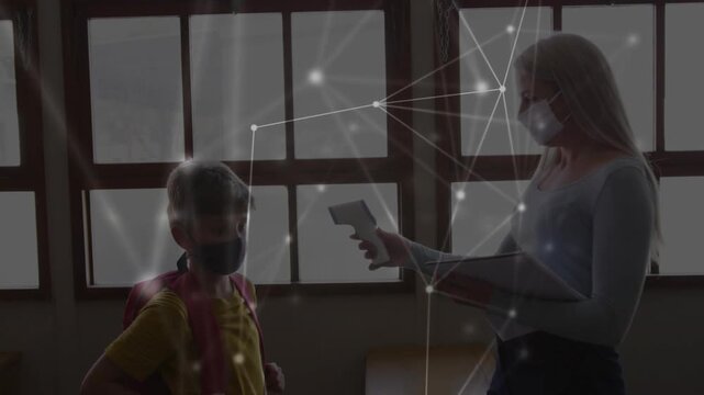 School staff scanning masked pupils arriving with IR gun, holding folder data overlay showing temps