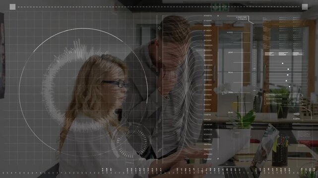 Man leaning and pointing at laptop woman touching keyboard HUD graphs animating for business review
