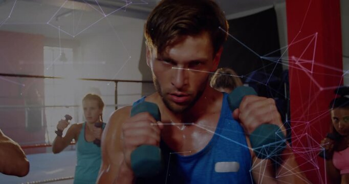 Coach thrusting weights leading class copying boxing jabs, shot widening, network overlay appearing