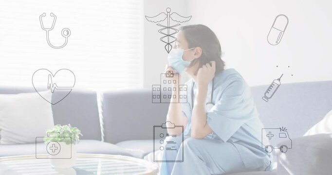 Healthcare worker sitting on sofa touching strap and adjusting mask waiting health icons overlaying