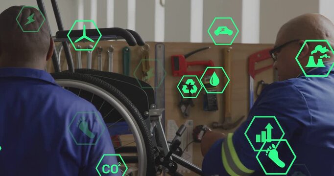 Two techs repairing medical wheelchair, introducing drill and showing green hex icons for alignment