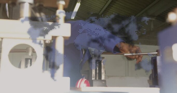 Tech checking reaching inserting rod into clamp turning lever and aligning in shop under dotted-map