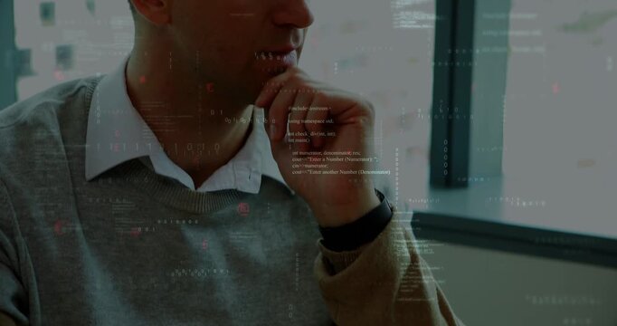 Office professional clicking mouse and resting chin while reviewing tech code overlay on screen