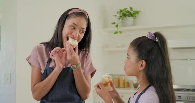 Mom placing cupcake, daughter tasting frosting for baking test, with animated sprinkles landing