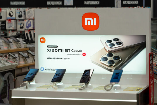 Display of Xiaomi 15 Series devices smartphones at an electronics store. Branding includes Leica partnerships. Minsk, Belarus - December 20, 2025