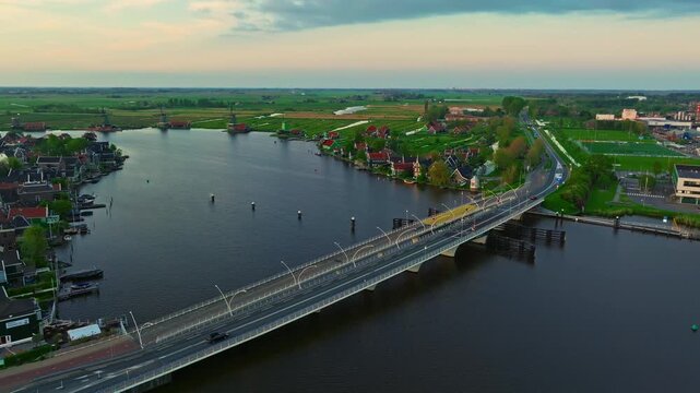 Aerial view of windmills at famous tourist site Zaanse Schans in Holland on sunset. Zaandam, Netherlands