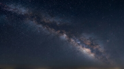 Fototapeta premium Milky Way Galaxy Stretching Across Night Sky with Stars and Cosmic Landscape