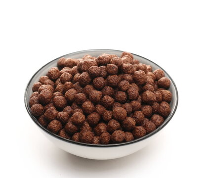 Chocolate cereal flakes in bowl isolated on white background
