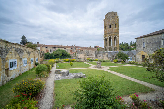 Tour Charlemagne in Charroux, France, with cloister garden