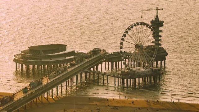 Aerial view of Scheveningen Beach in city Hague, Scheveningen Pier and famous Ferris wheel skyview de Pier