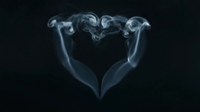 Smoke Forming Heart Shapes on Black.