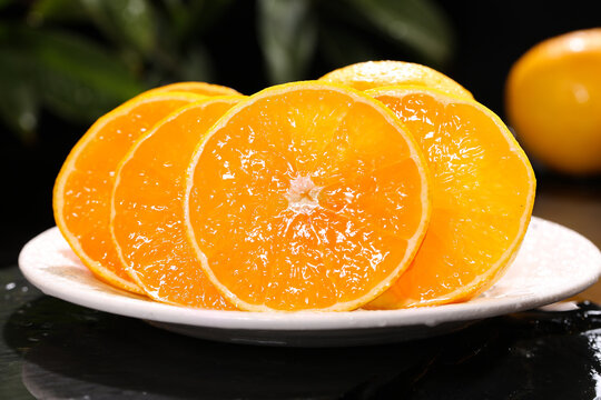 Fresh Orange Slices with Jelly Texture on White Plate Studio Photography