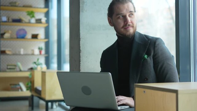 European businessman ceo specialist using computer for work online. Professional specialist businessman working on laptop pc sitting at desk in modern office space