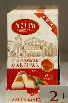 Curonian Spit, Russia - March 10, 2026: M. Zappa Konigsberger Marzipan box with almond confectionery, historical building illustration, German product