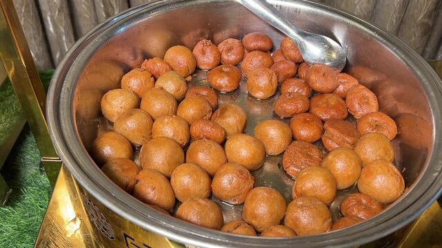 Mini ghee litti served in an Indian wedding