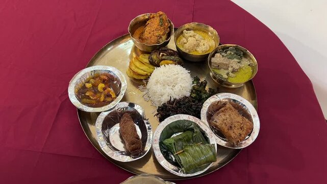 Bengali traditional dishes with Bhetki paturi, Katla Fish, fish fingers, and Sukta Posto