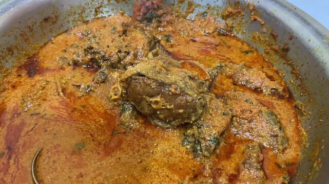 Authentic Bengali Katla Kalia: Fresh river fish steaks simmered in a rich, spicy ginger and onion gravy at an event in Kolkata