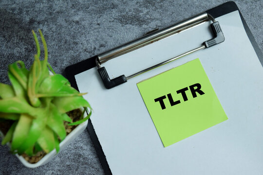 Concept of TLTR - Too Long Too Read write on sticky notes isolated on Wooden Table
