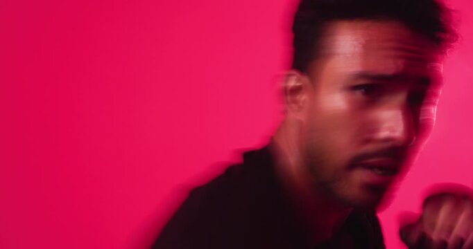 Face, boxing or man in studio for training, self defense or intense workout on red background. Serious, athlete or person with gloves for fight, technique or practice for motion blur or exercise