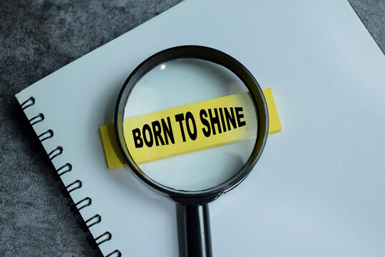 Concept of born to shine write on sticky notes isolated on Wooden Table.