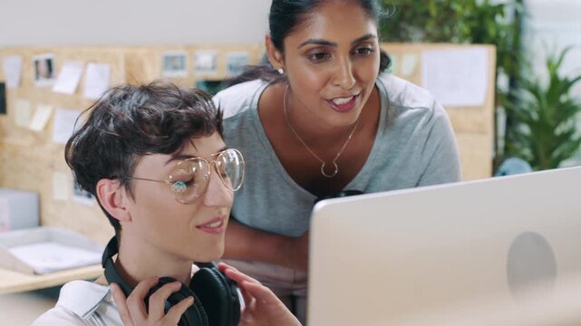 Team, computer and business women with help for graphic design, brand discussion and music. Idea, designer or creative people with tech in office for visual layout of logo, feedback or headphones