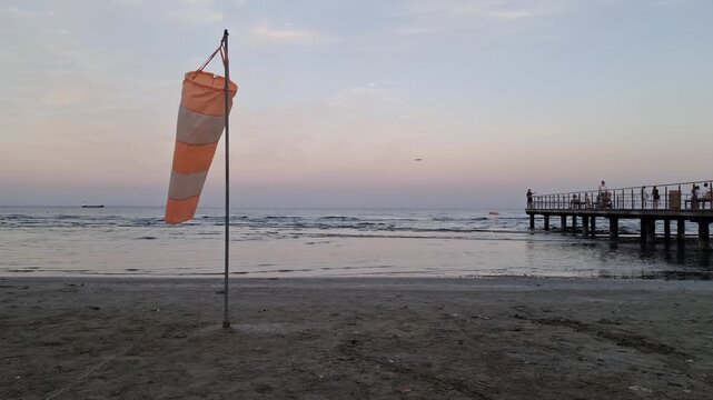 Windsock near the pier at Finikoudes beach in Larnaca, Cyprus.