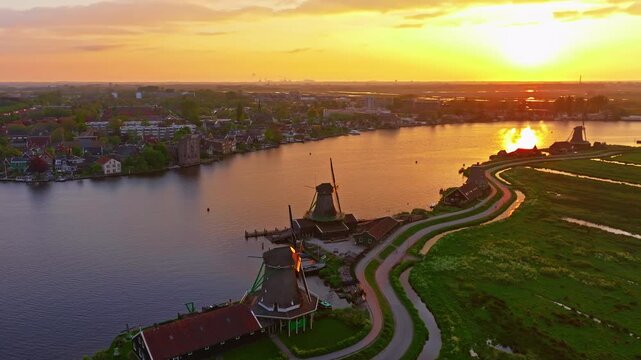 Aerial view of windmills at famous tourist site Zaanse Schans in Holland on sunset. Zaandam, Netherlands