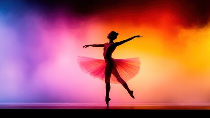 Obraz premium Ballet dancer performing gracefully on stage with vibrant lighting effects in the background during a night show
