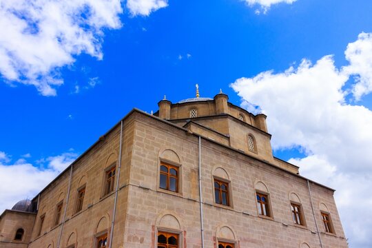 Ottoman Mosque Dome and Stone Facade Against Blue Sky Kars Turke