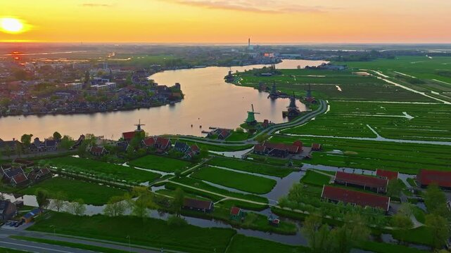Aerial view of windmills at famous tourist site Zaanse Schans in Holland on sunset. Zaandam, Netherlands