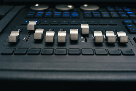 Close-up details of a DMX lighting control console