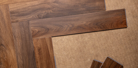 wood texture vinyl tile flooring installation in a herringbone pattern