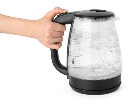 Woman holding transparent electric kettle on white background, closeup