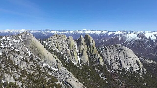 Springtime flyover of the Needles, a set of spikey and distinct granite domes in California's south-central Sierra Nevada mountains that predominate over the Kern Canyon Golden Trout wilderness.
