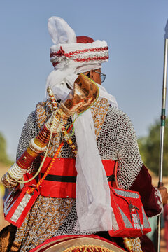 Argugun, Nigeria - 13 February 2026: View of a majestic rider, adorned in gleaming chainmail and vibrant red accents, gazes towards the horizon from Mata Fada village.